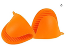 Two individual orange silicone pinch mitts, each with a textured, non-slip surface. One mitt is shown open, revealing the interior, while the other is upright. Both have small loops for hanging. They are displayed against a white background.