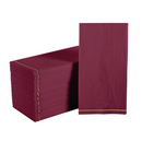 Stack of cranberry red and gold striped guest paper napkins arranged on a white background.