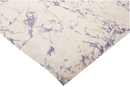 A close-up image of Con-Tact brand self-adhesive shelf and drawer liner, featuring a white background with prominent blue and subtle grey marble-like veining.