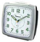 Impecca gray analog alarm clock with luminous hands and a loud bell alarm on a white background.