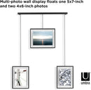 A modern black frame photo display featuring three frames suspended from a horizontal bar by thin rods.