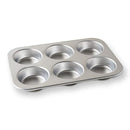 Nordic Ware natural aluminum jumbo muffin pan with six large round cavities on a white background.