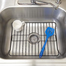 Two rectangular sink protector grids in a black finish, designed to fit in a kitchen sink, each with a central oval cutout for the drain and slightly raised feet, shown side-by-side.