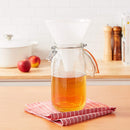 Natural-colored Hutzler 32-ounce wide plastic funnel with ribbed sides on a white background.