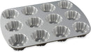 Graphite-colored Nordic Ware Brownie Bundt pan with twelve sculpted cavities, displayed on a white background.