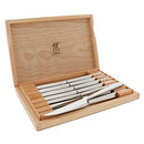 Premium Zwilling steak knife gift set, featuring sharp blades and comfortable handles, securely stored in a wooden case.
