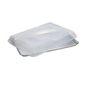 Nordic Ware natural aluminum half sheet pan with a clear plastic lid on a white background.