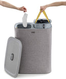 Joseph Joseph Total 90-liter laundry hamper in grey with two removable bags and lid, shown on a white background.