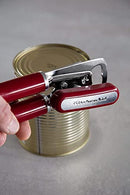 Red handled KitchenAid can opener with a silver cutting mechanism and bottle opener.