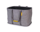 Grey Joseph Joseph collapsible 55L laundry basket with fabric handles, standing upright on a white background.
