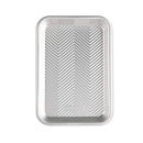 Nordic Ware Prism eighth sheet baking pan with embossed grid pattern and silver aluminum finish on a white background