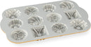 Nordic Ware Bundt Charms gold mini cake pan with 12 small Bundt cavities on a white background.