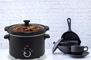 Matte black slow cooker with clear glass lid and control dial.