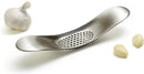 Joseph Joseph stainless steel garlic rocker crusher with curved design shown on a white background.