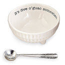 Mud Pie Circa Ceramic 2-Piece Guacamole Set featuring a white ceramic bowl with the text "It's five o'guac somewhere" and a silver-toned spoon engraved with "HOLY GUACAMOLE."