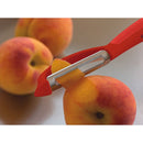 The Original Swiss Peeler by Kuhn Rikon, shown in red, with a durable carbon steel blade for easy vegetable and fruit peeling.