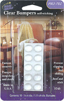 A retail package of "Magic Mounts Pro-Tec Clear Bumpers self-sticking," showing a blister pack with a sheet of eight circular clear bumpers, and a background image of furniture. The packaging highlights features like "Fastens securely," "Prevent scratches and dents," "Prevent slipping and sliding," and "Peel and stick." It also states "Made in U.S.A." and "Contents: 10 - 7/16 in dia. / 1.11 cm dia. Bumpers.