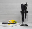 Modern and practical knife and scissor storage by Kuhn Rikon, a transparent block with black details that keeps blades organized and visible.