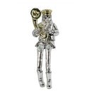 lver-toned figurine of a person with a beard, wearing a cap and boots, playing a gold-toned tuba with dangling cloth legs.