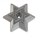 Silver-toned metal baking mold in the shape of the Star of David with central opening.