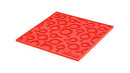 Lodge 7-inch red silicone hot pad and trivet, heat resistant, non-slip, featuring a textured cast iron pan design.
