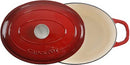 Red enameled 7-quart cast iron Dutch oven with matching lid on a white background.