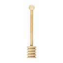 A small, light-colored wooden honey dipper. It has a rounded knob at the top, a slender cylindrical handle, and a grooved, bulbous end designed to drizzle honey.