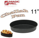 Magic Mill 11-inch round challah pan with a dark nonstick interior and exterior. The packaging features the "Magic Mill" logo, the words "Challah Pan" in stylized text, and an image of a baked challah bread in a smaller pan.