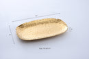 Pampa Bay Golden Millennium serving platter with a textured gold finish and dimensions of 14 inches by 9 inches.