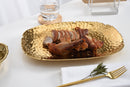 Pampa Bay Golden Millennium serving platter with a textured gold finish and dimensions of 14 inches by 9 inches.