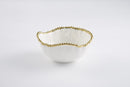 Elegant white ceramic bowl with a wavy rim and gold beaded edge detailing.

