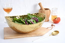 Elegant Pampa Bay Golden Millennium large oval bowl with a richly textured, hammered gold surface and an irregular rim.