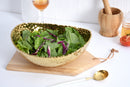 Elegant Pampa Bay Golden Millennium large oval bowl with a richly textured, hammered gold surface and an irregular rim.