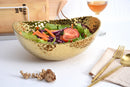 Elegant Pampa Bay Golden Millennium large oval bowl with a richly textured, hammered gold surface and an irregular rim.