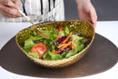 Elegant Pampa Bay Golden Millennium large oval bowl with a richly textured, hammered gold surface and an irregular rim.