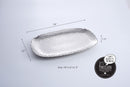 Pampa Bay Millennium large serving platter, showcasing its unique textured silver finish and sophisticated design for serving food.