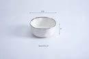 Small serving bowl from the Bianca collection, featuring a white glossy finish and a thin silver line around the edge.