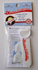 White fabric tag with a plastic ring, printed with the red text "Kosher Fridg-eez" on a dark background.