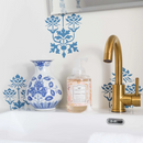 Clear bottle of Greenleaf Cashmere Kiss foaming hand soap with a white pump, featuring a warm floral fragrance and a decorative label.