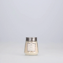 Vintage-inspired clear glass jar candle with a silver lid, labeled "Greenleaf Haven