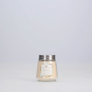 A small, cream-colored candle from Greenleaf, in the Bella Freesia fragrance, presented in a clear jar with a silver lid.