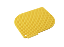 Yellow silicone honeycomb-patterned pot holder with curved edges on a white background.