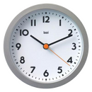 Round wall clock featuring a silver frame, a white dial with black Arabic numerals, black hour and minute hands, and an orange second hand. The brand name "bai" is visible below the number twelve.