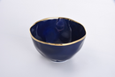 Elegant Pampa Bay Sunset by the Sea large porcelain serving bowl in a deep blue with a wavy gold rim, measuring 8.5 inches in diameter and 5 inches tall.