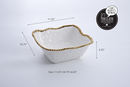 Large square salad bowl in white porcelain with a textured surface and a beaded golden rim.