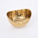 Pampa Bay small oval bowl with a hammered gold finish and textured, organic rim, suitable for serving or decoration.