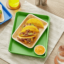 Rectangular green baking pan measuring 9-1/4" x 13-1/4" with smooth sides and a glossy finish, displayed on a table