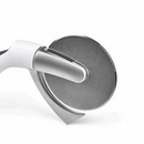 A Zyliss Sharp Edge Pizza Cutter in its original packaging. The cutter features a stainless steel blade with a gray safety guard and a white ergonomic handle. The packaging is white and gray with the Zyliss logo and product name clearly visible. An inset image shows the cutter in use.