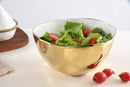 Stylish large serving bowl from Pampa Bay's Moonlight collection, featuring a gold tarnish-free outer surface, a white inner surface, and an organic gold rim.