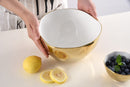 Stylish large serving bowl from Pampa Bay's Moonlight collection, featuring a gold tarnish-free outer surface, a white inner surface, and an organic gold rim.